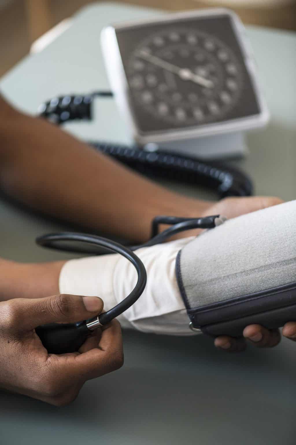 Nurse measuring patient blood pressure