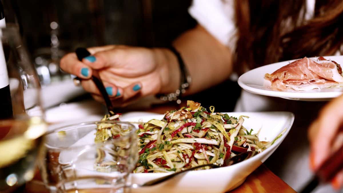 a woman eating salad