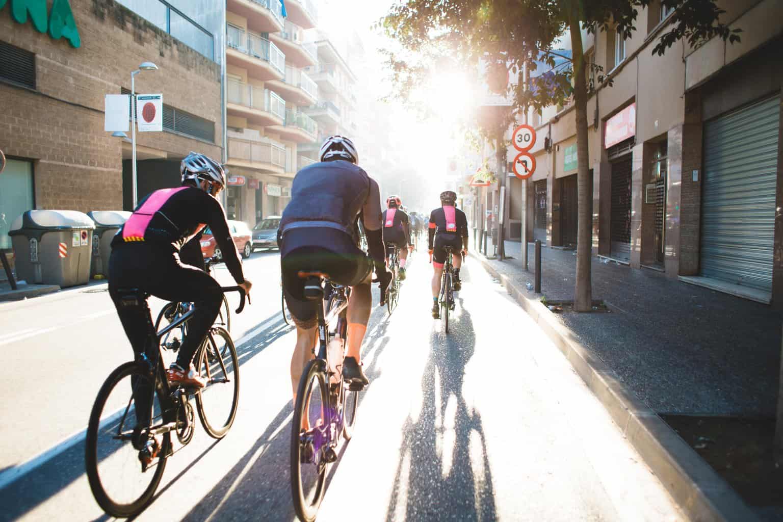 image of people cycling together