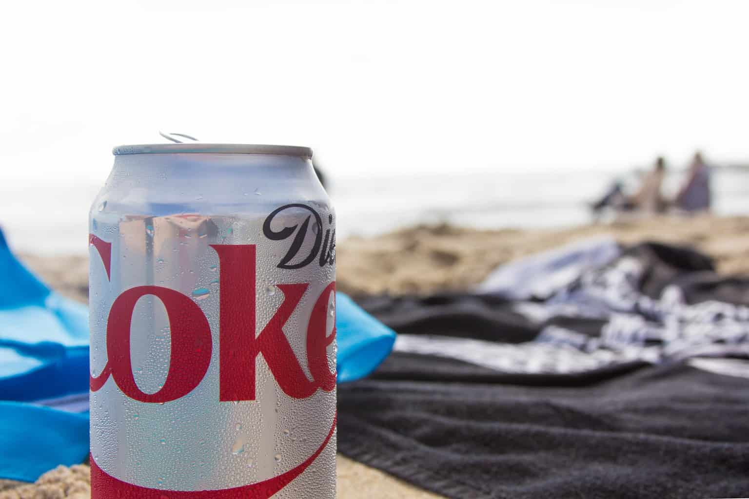a can of diet coke at the beach