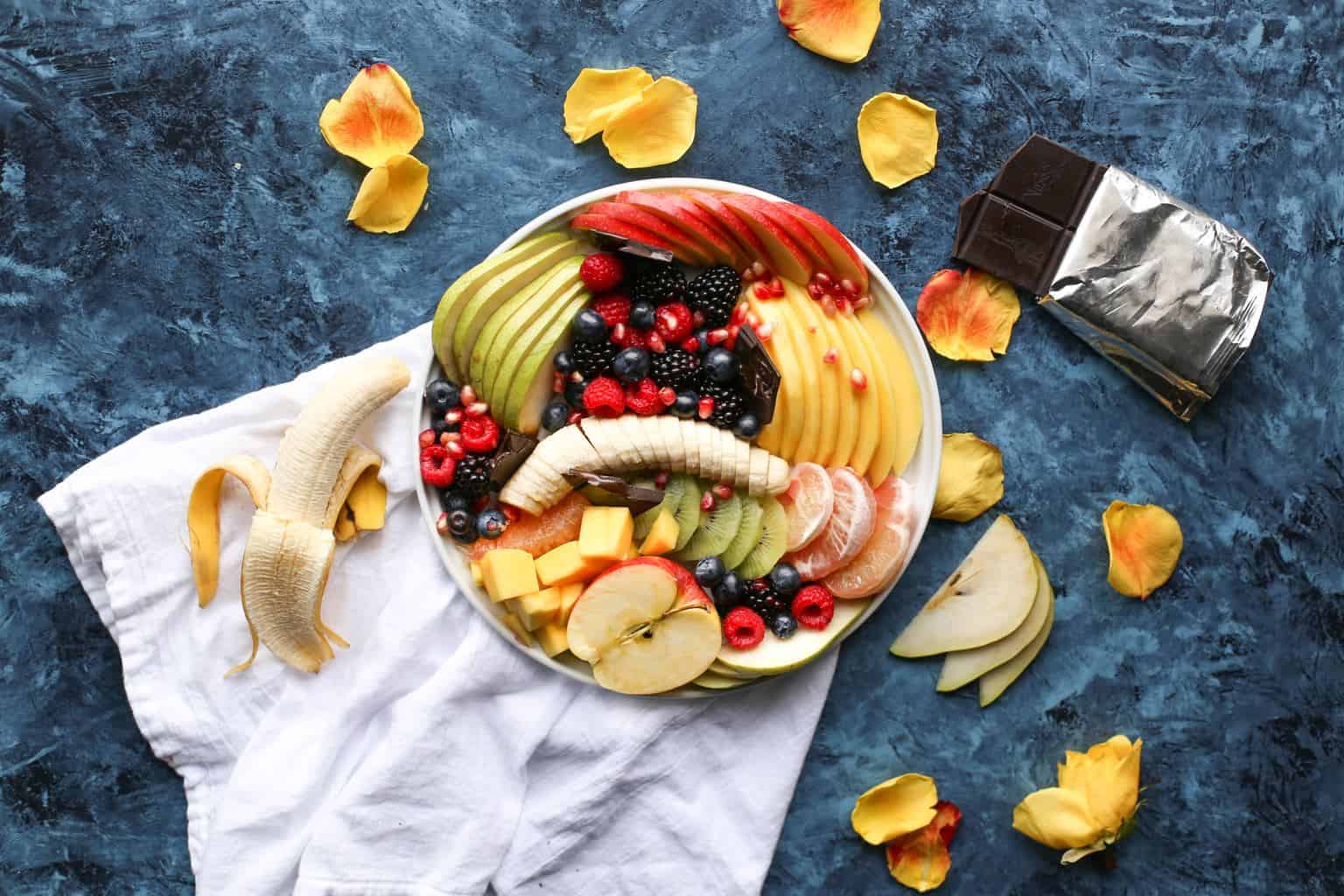 a bowl of sliced fruits