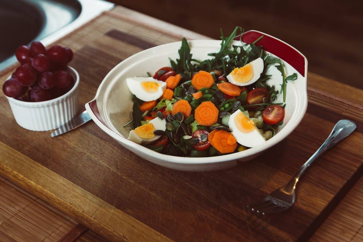 a bowl of salad with eggs