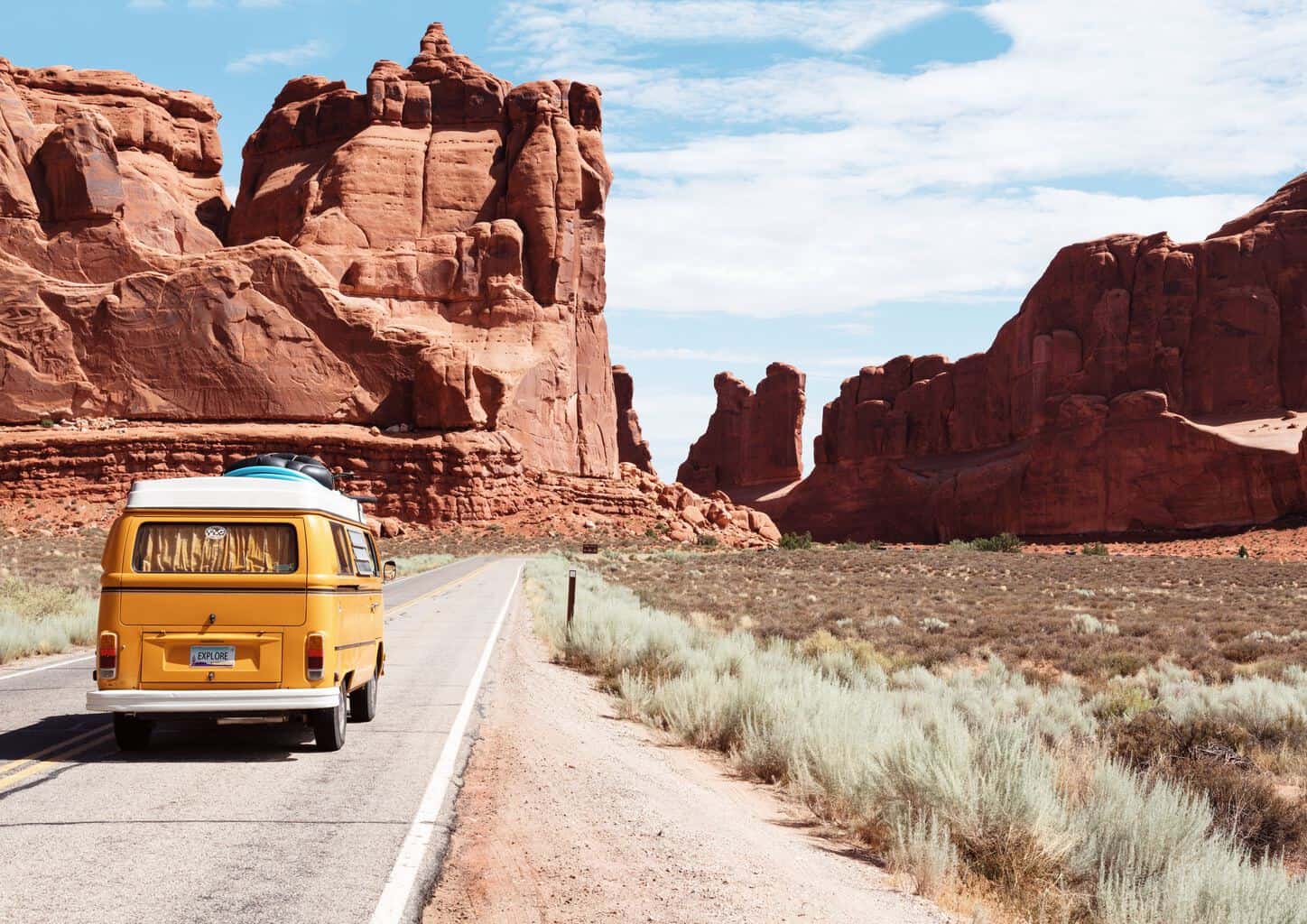 yellow Volkswagen on the road